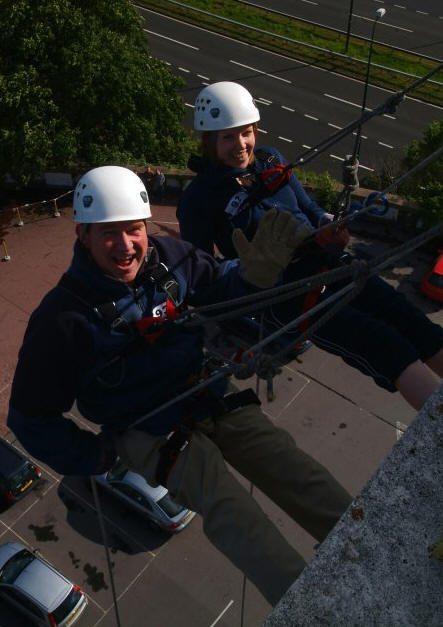 Peter and Caroline start the 100 ft descent from the top of the hotel